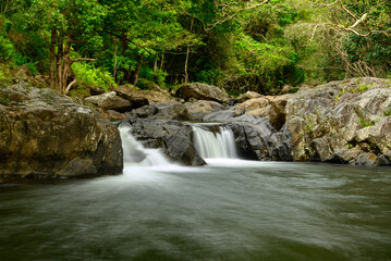 Along the Crystal Cascades near Cairns in Far North Queensland, locals and tourists enjoy swimming, hiking, picnicking, and exploring lush rainforest and freshwater streams.
