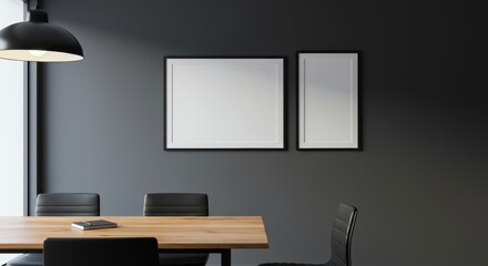 Contemporary office interior features a wooden conference table with picture frames on a gray wall offering a mockup space