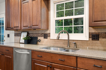 Modern stainless steel kitchen sink with sleek faucet and clean countertop
