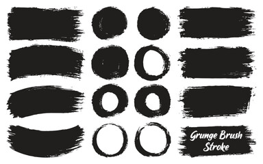 Collection of black grunge brush strokes and oval shapes on a white background