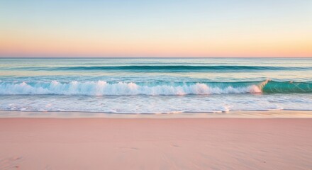 Gentle waves washing onto a sandy beach under a pastel colored sky above