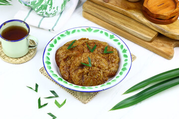 Kue Cucur, Indonesian traditional cake, made from rice floor, palm sugar. Popular street food in Indonesia for tea time or snacking time. Isolated background.