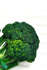 Vibrant Green Broccoli Placed on White Surface