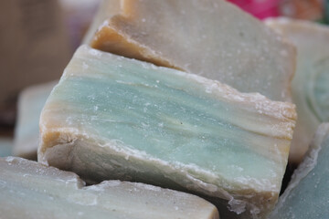 Natural soap bars in soft blue and cream colors on display