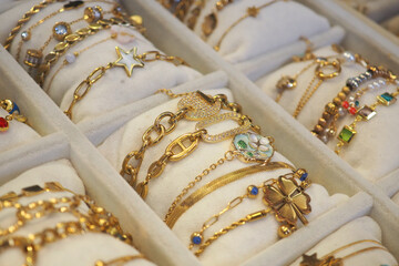 Beautiful gold bracelets displayed in a jewelry store