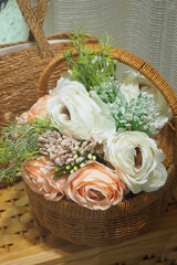 Beautiful floral arrangement in a wicker basket for decor