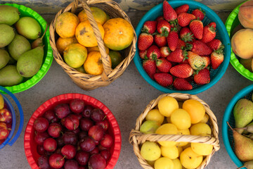 Variety of fresh fruit in baskets at a local market