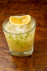 A classic citrus Margarita or Caipirinha cocktail with a lime zest rim and fresh orange slice...
