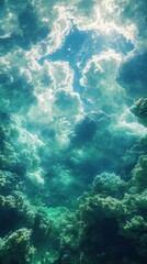 Fototapeta premium Sun Rays Streaming Through Cloudy Sky Above Underwater Coral Reef