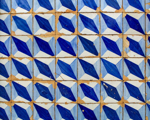 Colonial tiles, decorated with geometric patterns, blue and white on the facade of a colonial...