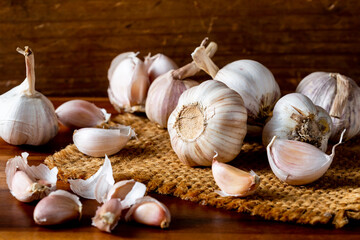 Fresh Garlic Bulbs and Cloves on Rustic Wooden Table Background