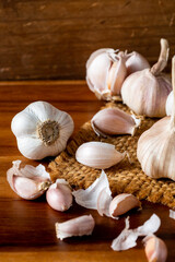 Fresh Garlic Bulbs with Cloves on Rustic Wooden Background