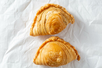 Delicious Golden Brown Pastries on Crinkled White Background
