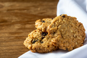 Freshly Baked Cookies on White Cloth with Wooden Surface Background
