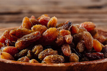 Healthy Dried Fruits: Nutritious Raisins in a Wooden Bowl