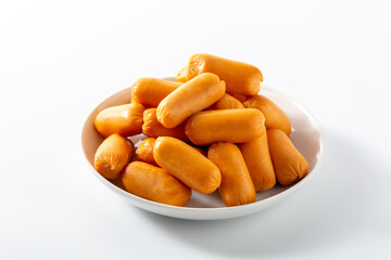 Fresh Orange Sausages on Plate Ready for Delicious Meal Preparation