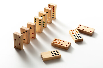 Colorful Wooden Dominoes Arranged in a Creative Pattern on White Surface