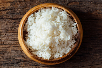 Freshly Cooked White Rice in Wooden Bowl on Rustic Wooden Table