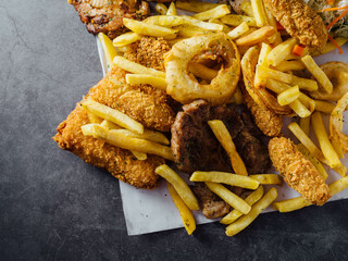 Delicious Assorted Fried Foods with Crispy French Fries on Plate