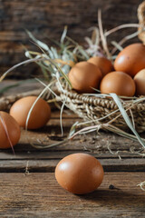 Fresh Brown Eggs in a Rustic Basket on Wooden Table Surface