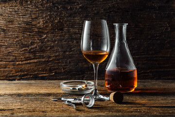 Elegant Glass and Carafe of Wine on Rustic Wooden Table Setting
