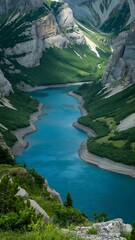 Turquoise river flows through a scenic canyon with towering cliffs and lush green vegetation on the mountain sides.