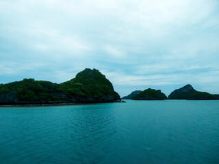 Beautiful Seascape with Mountains, Blue Ocean, and Islands under Clear Sky at Ang Thong National Marine Park, Koh Samui, Thailand