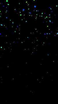 Falling shiny green confetti isolated on transparent video black vertical background. Bright festive tinsel of green color.	
