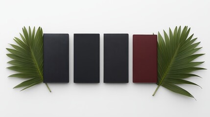 Four leather-bound books arranged on a white surface.