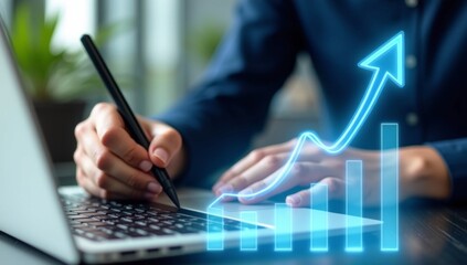 Close-up of businessman or woman hands working on laptop and tablet at office desk