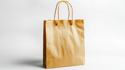 Empty kraft paper shopping bag on a white background.