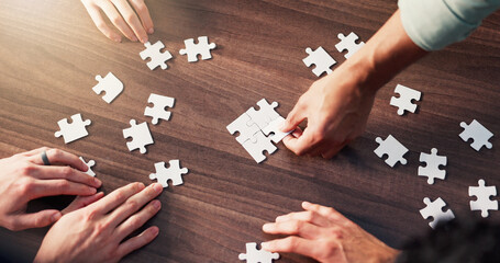 Puzzle, collaboration and hands of business people in office with synergy, teamwork or unity....