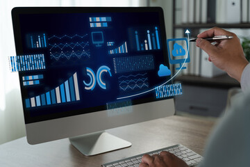 Business intelligence Person analyzing data computer screen with graphs and cloud icons, indicating data analysis and technology use professional
