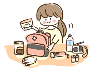 A woman preparing a disaster prevention backpack