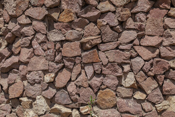 Stone masonry of granite stones as a background