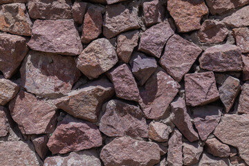 wall of large flat stones, with different colors and sizes