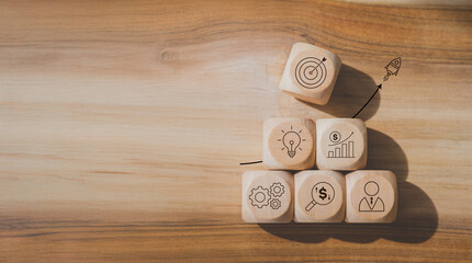 Rocket launching from wood cube with business icon, Start-up, Creativity, Big idea, Business goals management, Investment on new project to wealth, Company strategy target, Sustainable financial plan
