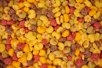 Sweet crunchy cornflakes as a background. Top view.