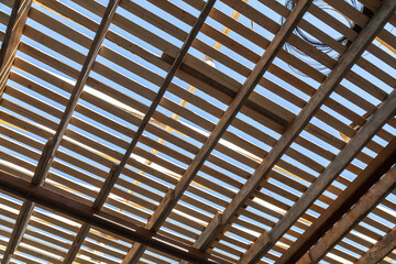 Wooden slats with sun shining through