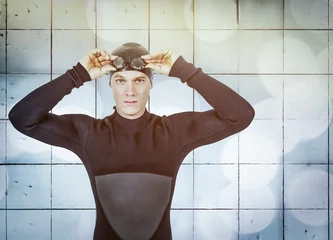Poster Portrait of swimmer against digitally generated wall