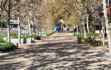 Footpath by street in city