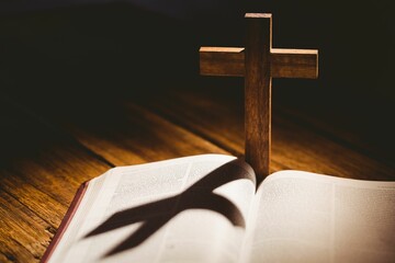 Cross shadow falling on bible