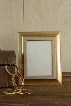 Photo frame and bangles on table