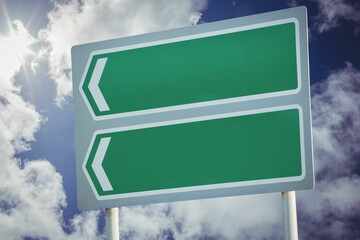 Green sign post against cloudy sky