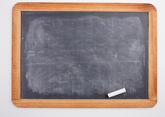 Chalkboard with piece of chalk
