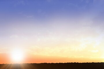 Rising sun is peeking above horizon silhouette in flat design, with warm gradient sky © vectorfusionart