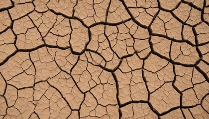 Detailed close-up of dry, cracked earth texture caused by drought or extreme heat. The natural pattern of deep fissures and earthy tones creates a compelling background for environmental themes