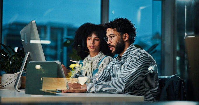 Colleagues, team and collaboration with computer at night, office or journalist with article on web. Reading, research and people with tech for story, creative or working late for project in newsroom