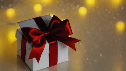 White gift box decorated with vivid red ribbon bow on reflective surface - Powered by Adobe