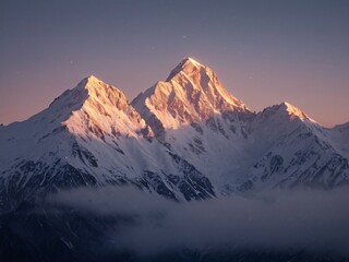 Majestic snow-capped mountains bathed in dawn's glow.